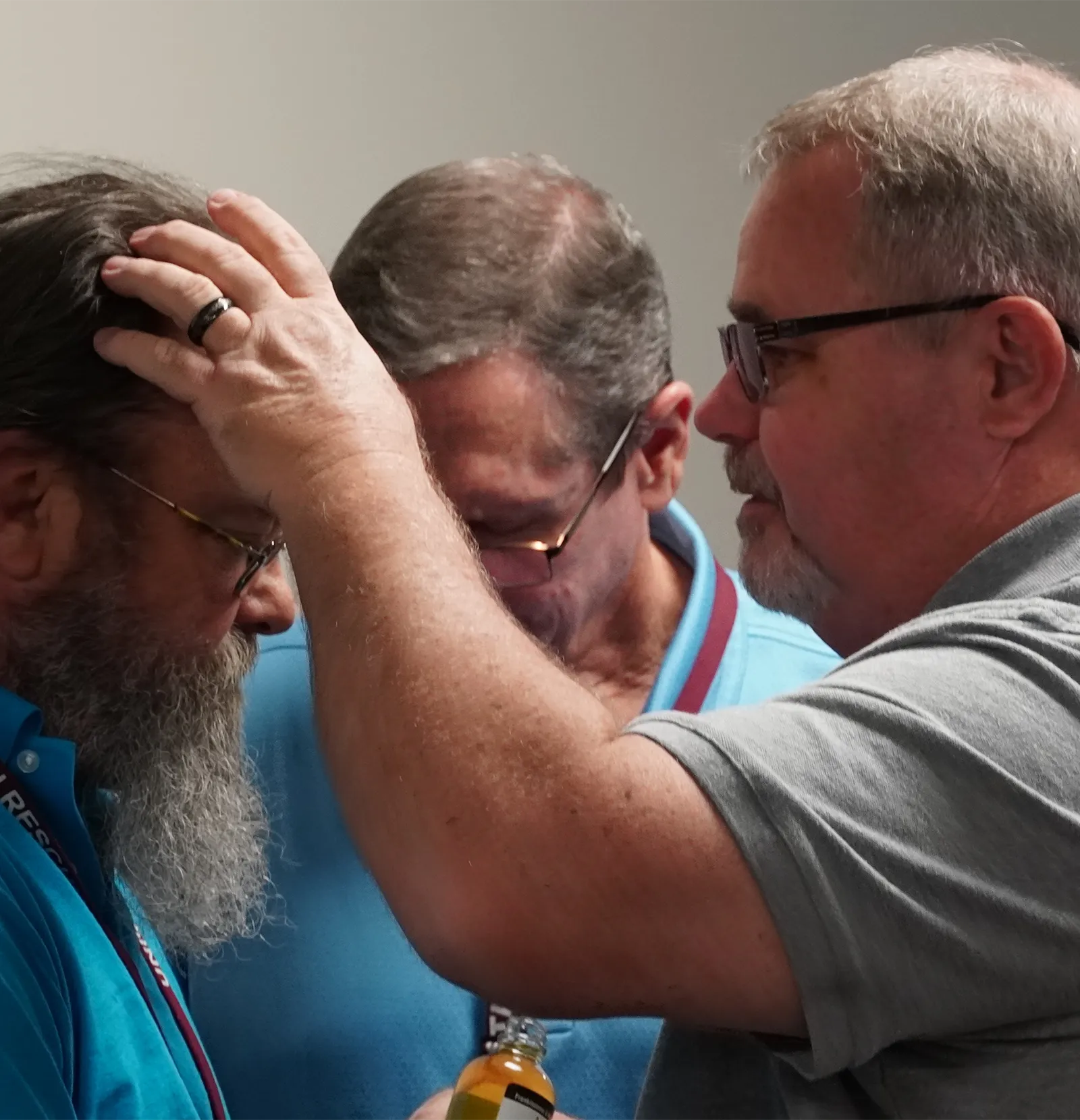 man being blessed and prayed over at urm wichita