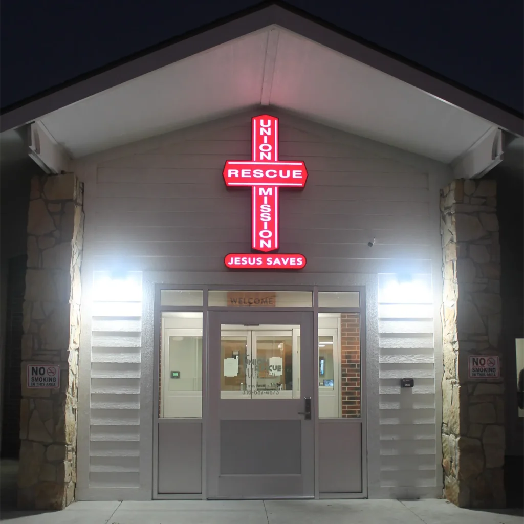 urm cross illuminated at night